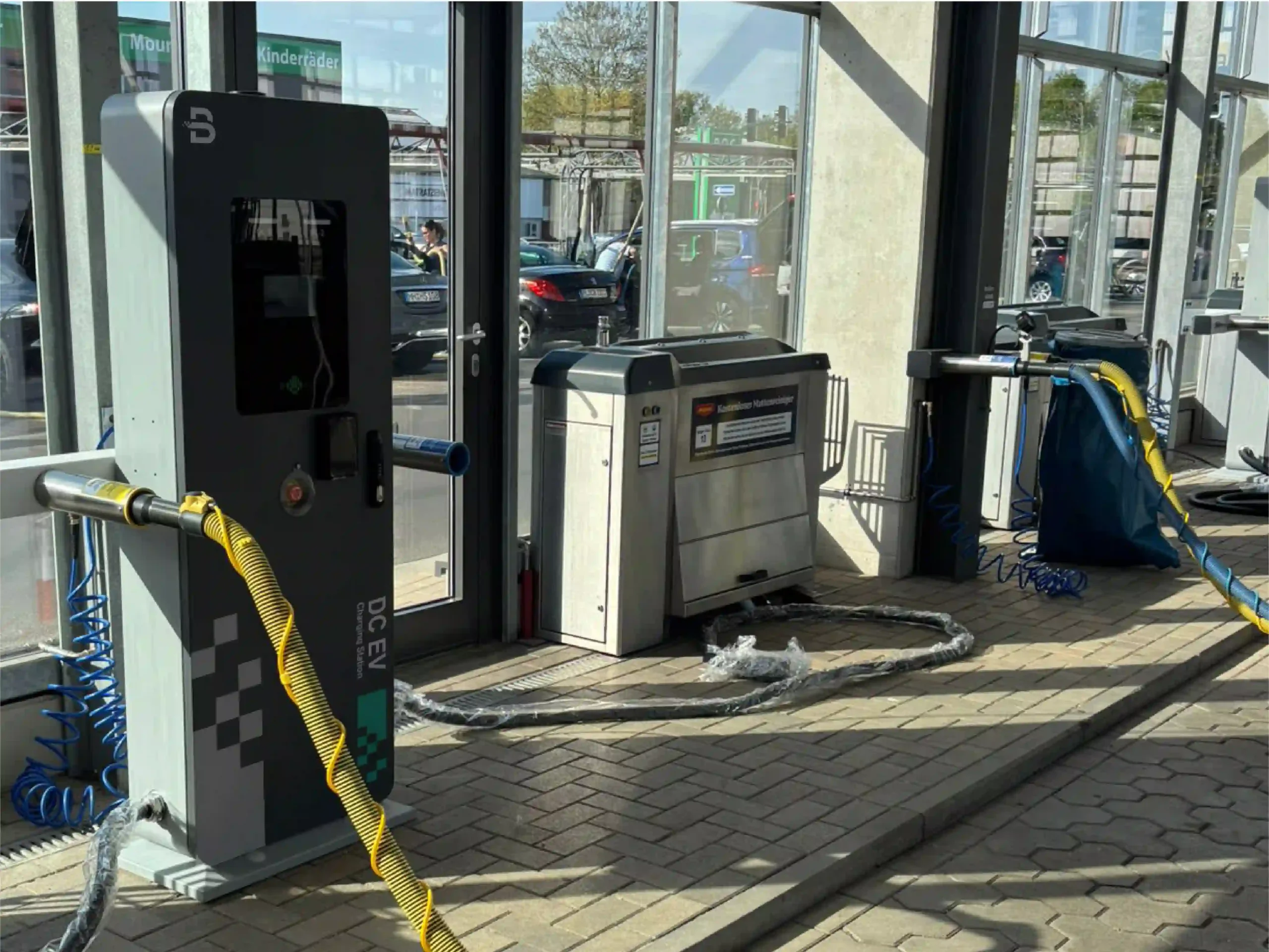 Separate charging terminals at BENY's car-wash charging project in Germany
